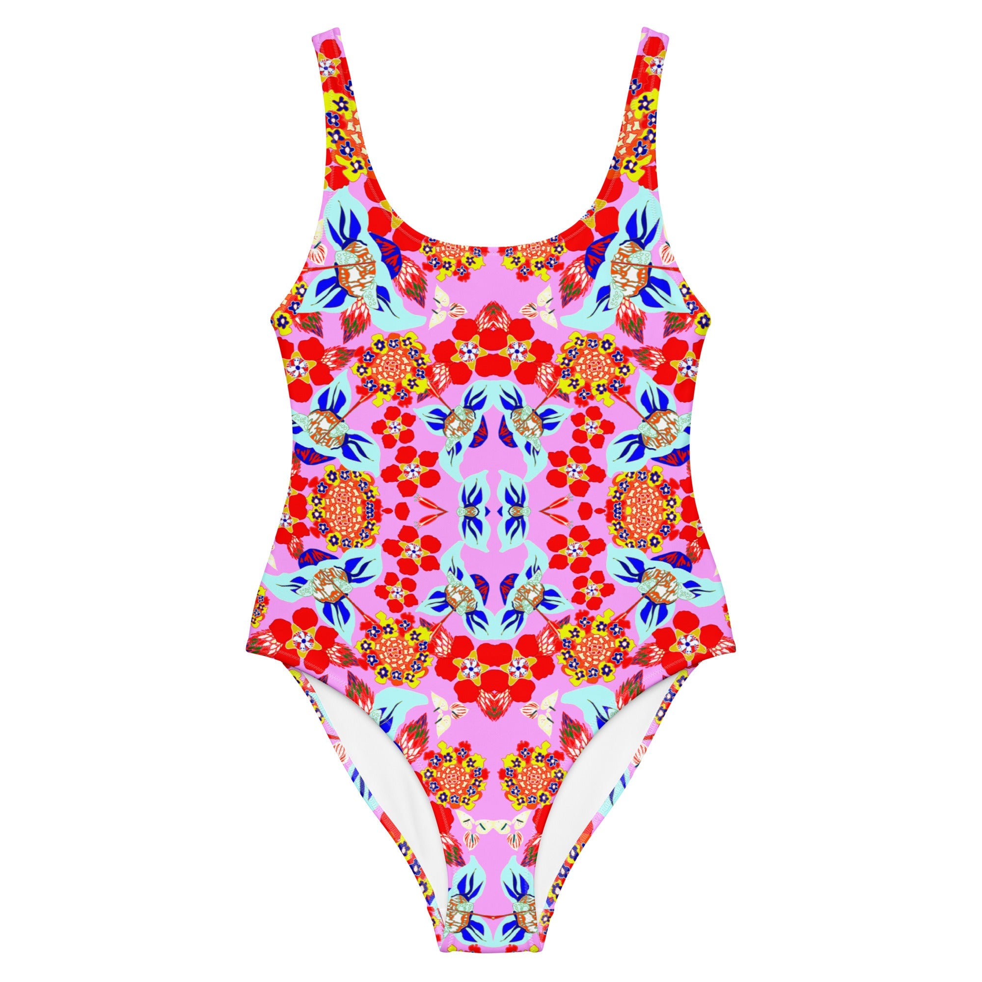 One-piece swimsuit with a vibrant pink floral and geometric all-over print in red, blue, yellow, and aqua.