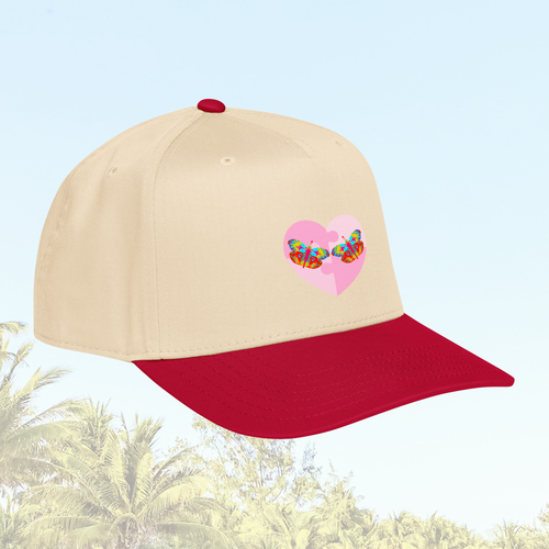 Beige and red cap with a colorful butterfly heart design on a light blue background
