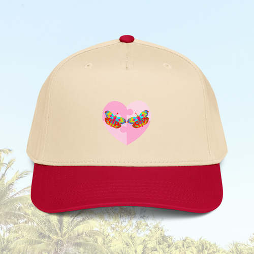 Beige cap with red brim featuring a colorful butterfly heart design against a blurred background of sky and trees.