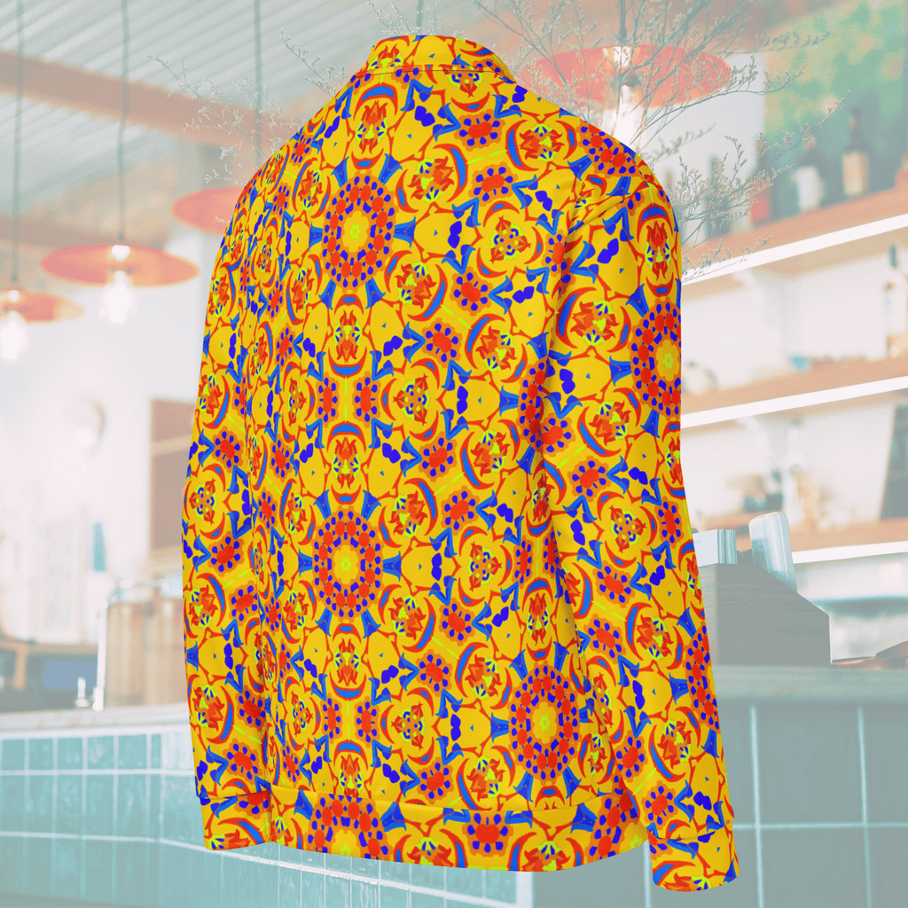 Rear angled ghost mannequin view of a yellow streetwear bomber jacket, highlighting the seamless alignment of the vibrant orange, blue, and red mandala kaleidoscope print across the shoulder and sleeve.