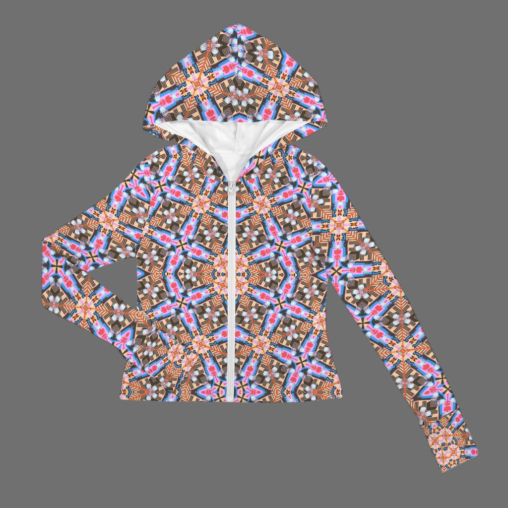 Flat lay studio shot of the front of a zipped performance jacket featuring a white zipper, a fitted hood with a clean white lining, and a vibrant kaleidoscope geometric pattern against a grey background.